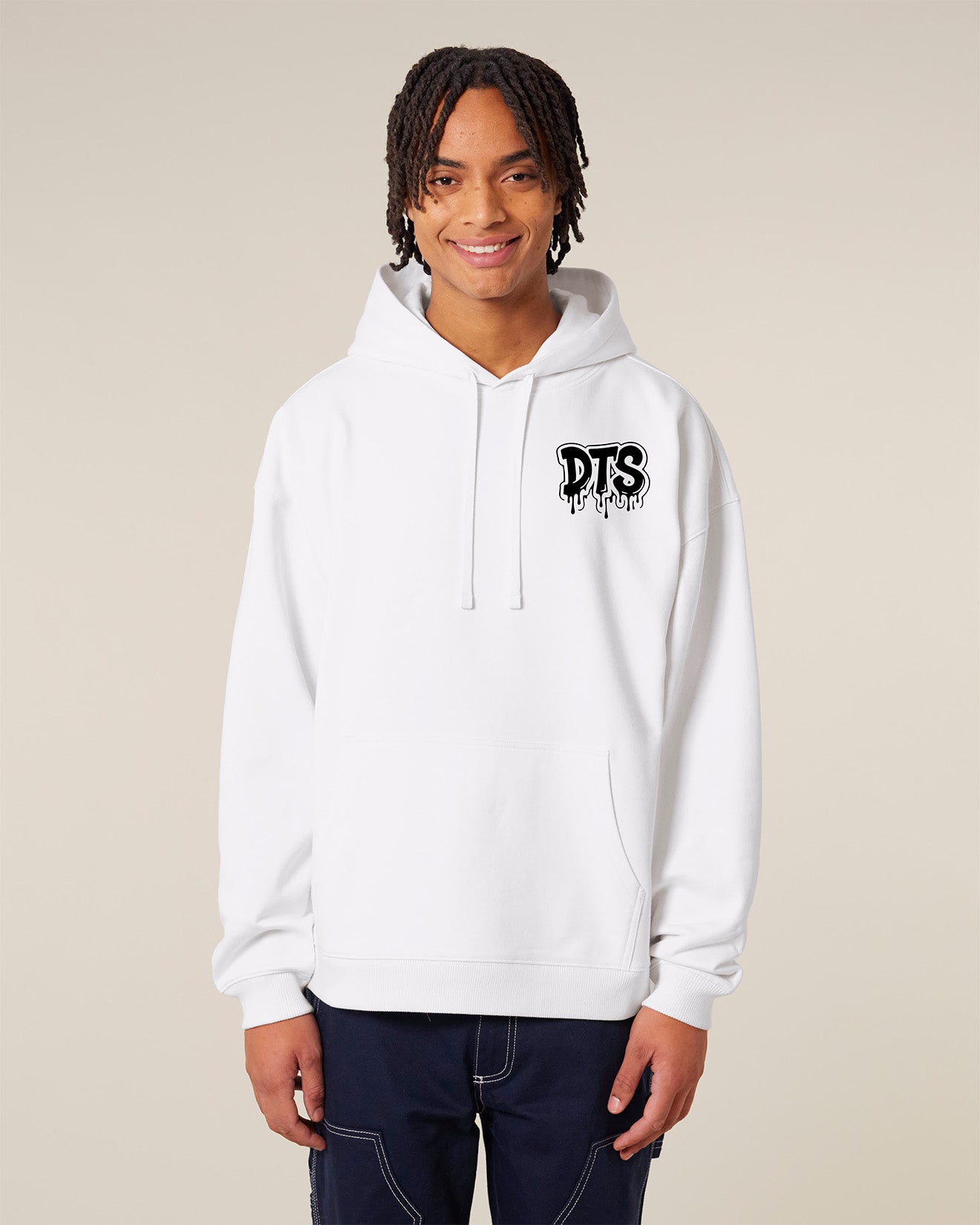 Person wearing a white hoodie with 'DTS' logo on a beige background