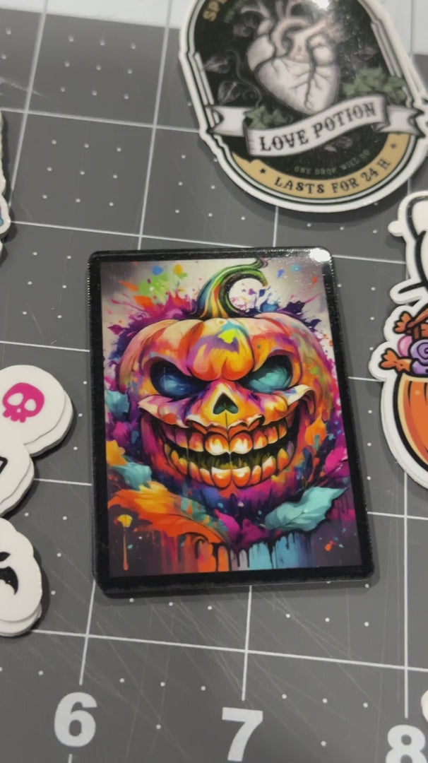 Video of spooky Halloween stickers and cute kid friendly stickers. Pumpkins, Hello Kitty, and jack-o-lanterns. 